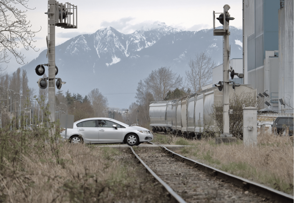 car in the middle of a train railway