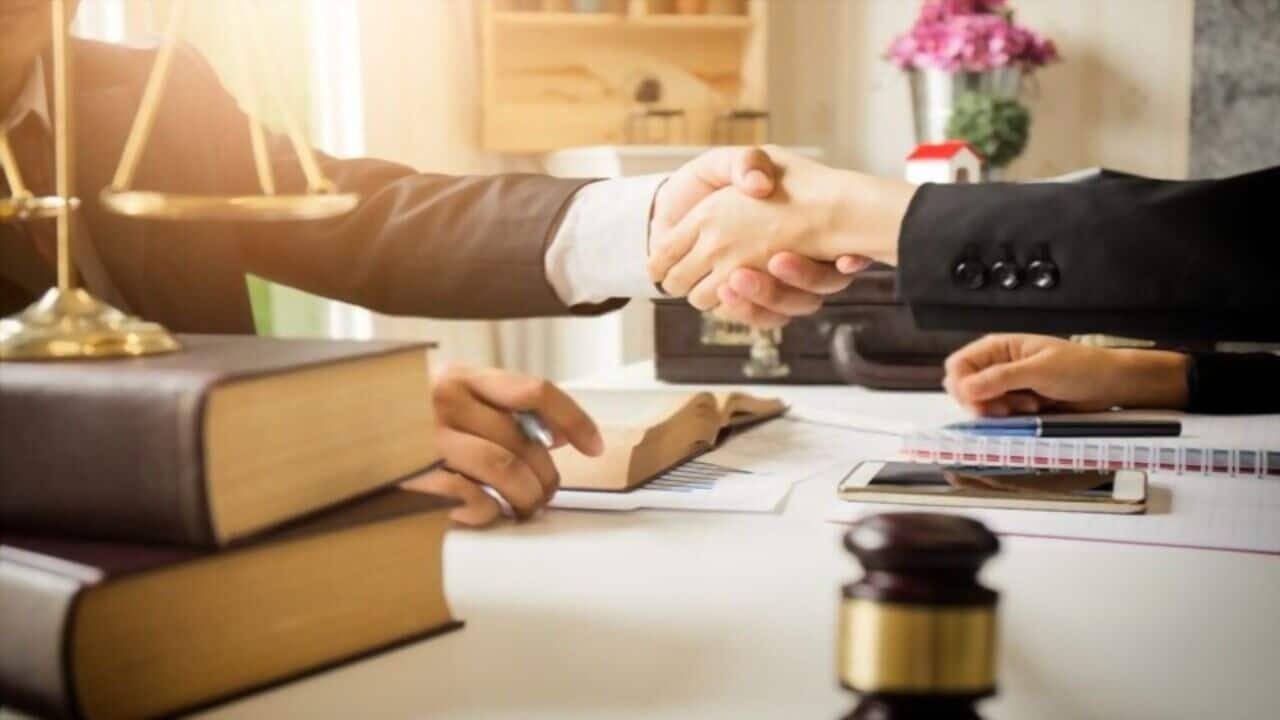 Lawyer and His Client Shake Hands