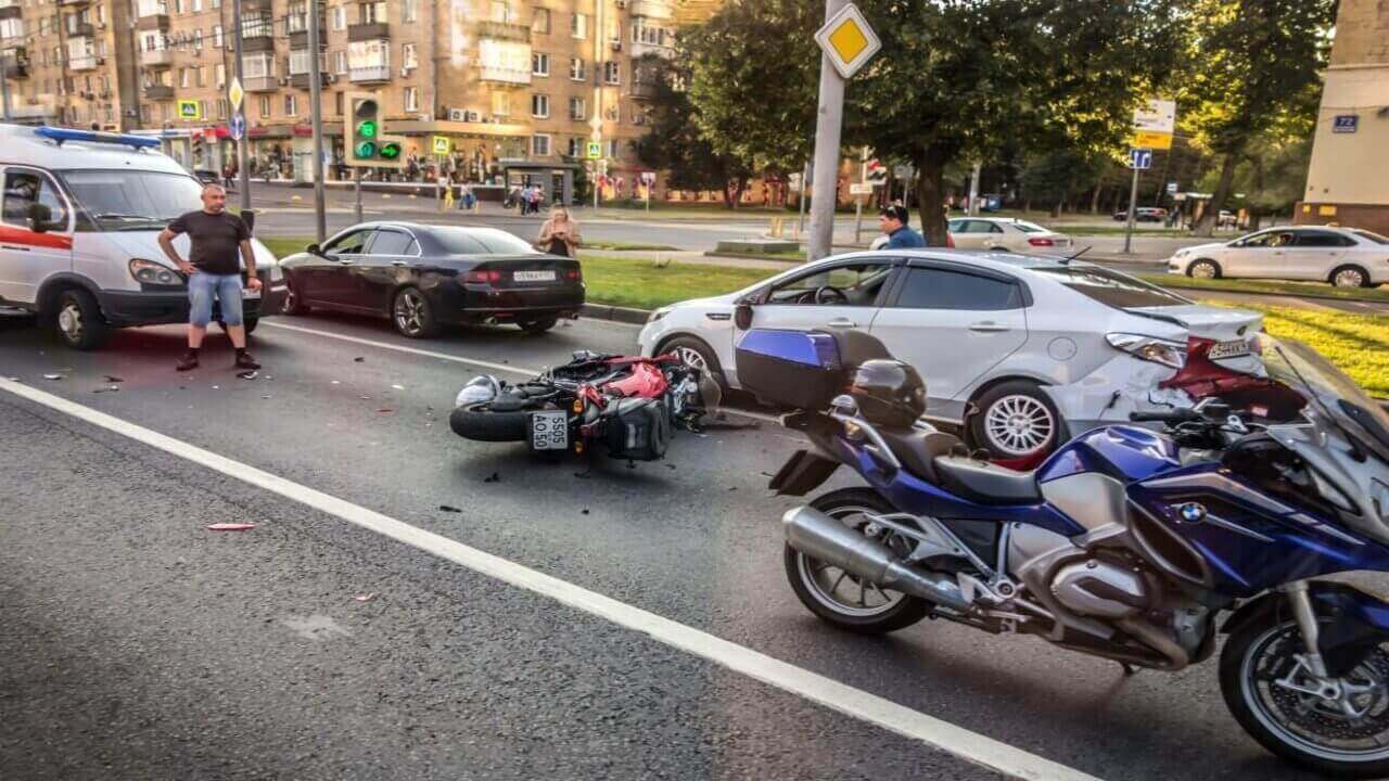 Motorbiker Trying to Overtake the Car and Crashed into the Car and Fell with His Passenger