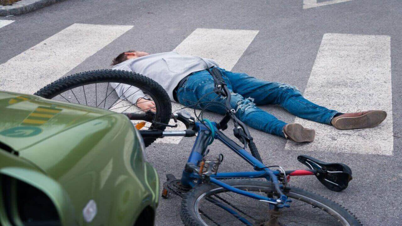 A Man Wearing a Gray Jacket Got into an Accident in the Pedestrian Lane While Riding a Bicycle