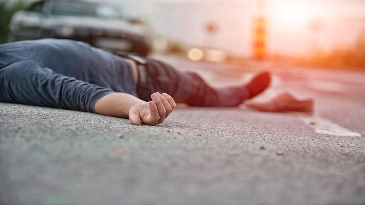 Man Lying in the Pedestrian Lane After Being Hit by a Car in a Traffic Accident