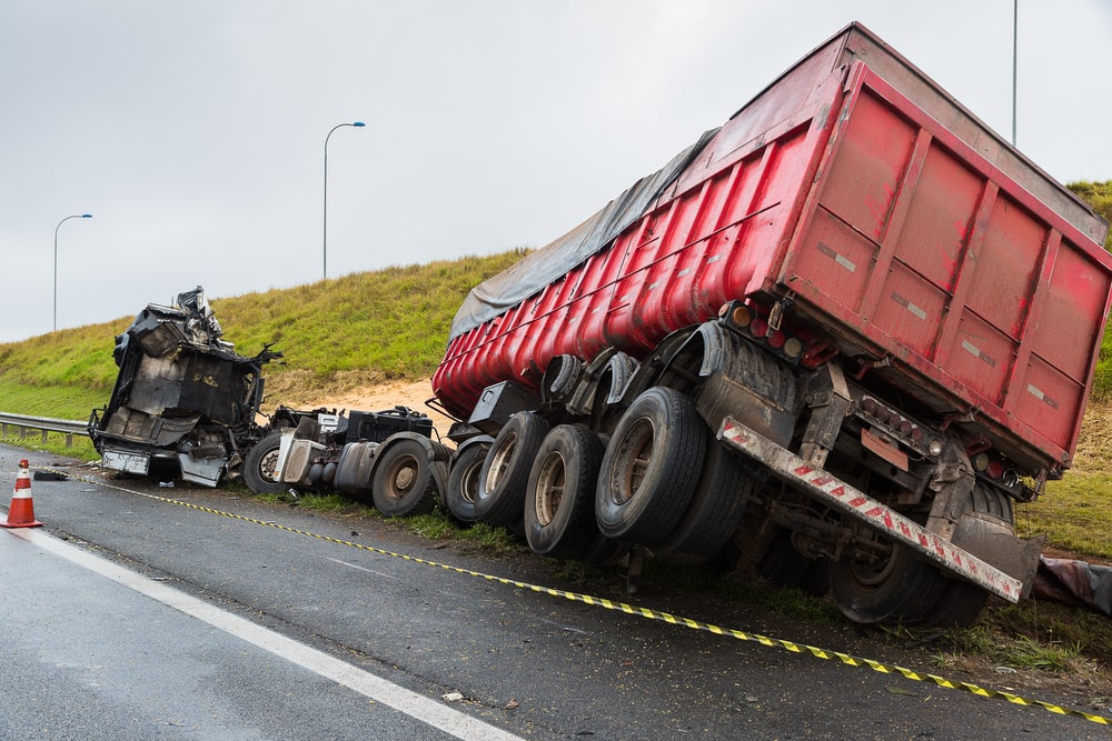 Washington truck accident lawyer reviewing case files with client