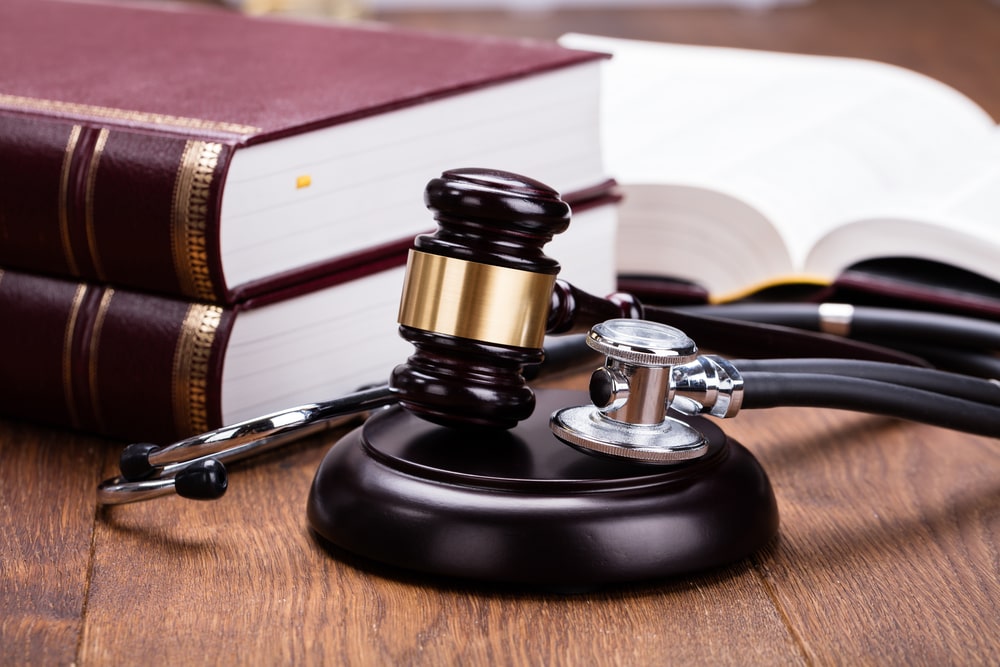 Lawyer negotiating with insurance adjuster over phone